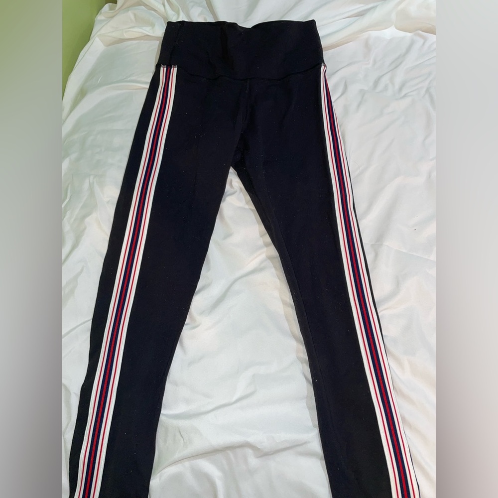 Black leggings with red, navy, and white stripe